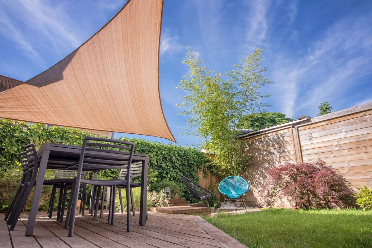 shade sail covering furniture in backyard